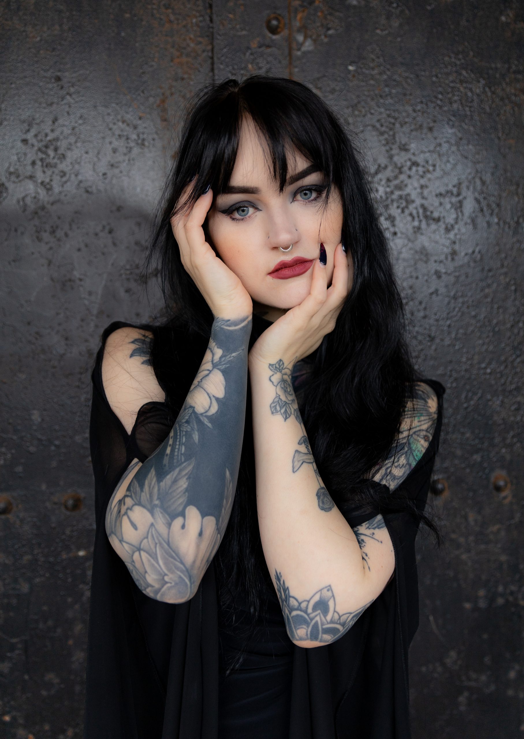 emo girl holding face long nails