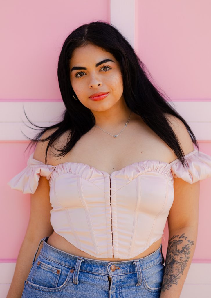 pink garage door portrait of a woman in san francisco